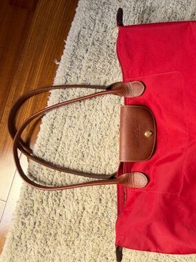 red large longchamp le pilage tote bag